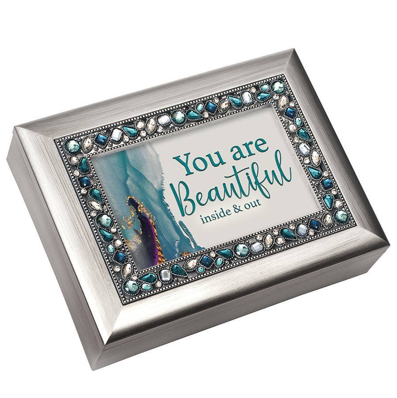 Silver music box front with blue jeweled border and 'You are Beautiful' text