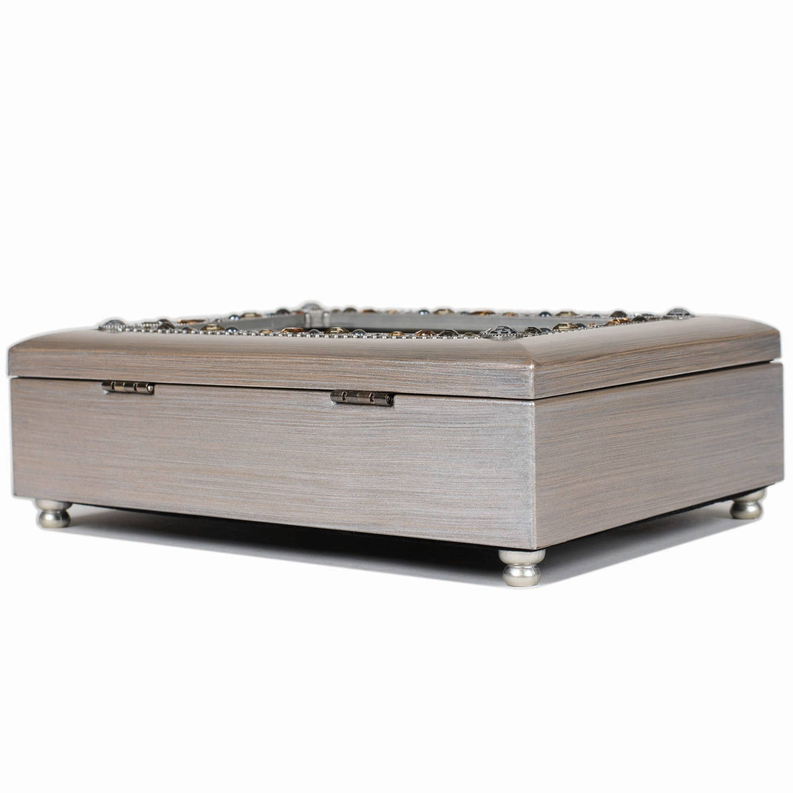Silver music box top with bead trim, hinged lid, and metal feet