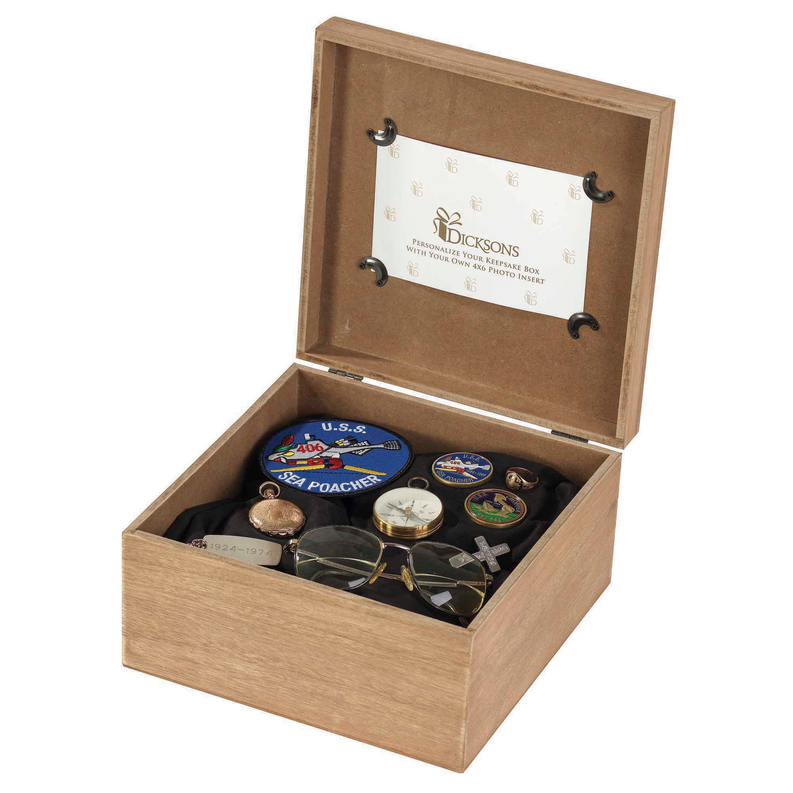 Firefighter keepsake box with open lid showing coins, patches, and small memorial items.