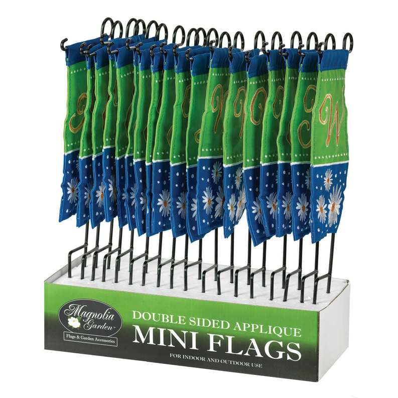 Set of mini monogram flags on display, blue/green with N and daisy appliques
