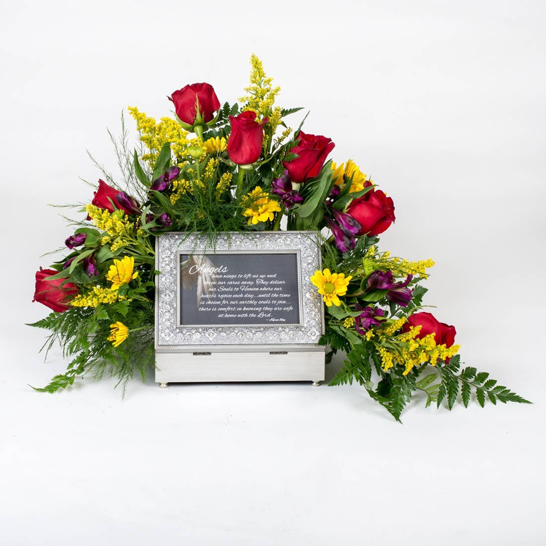 Jeweled music box centerpiece with mixed-color flowers beside it