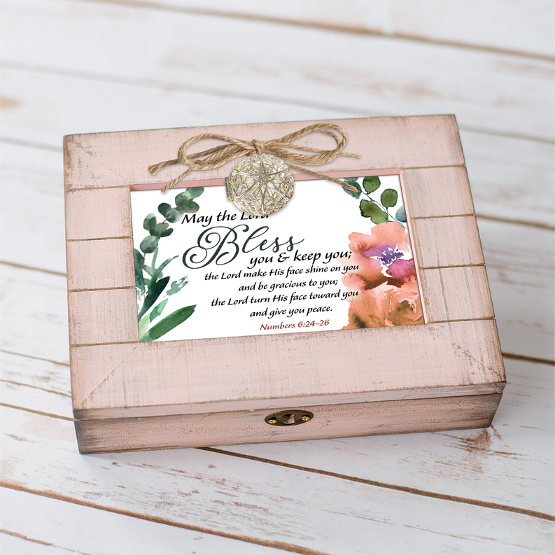 Pink distressed wooden music box with floral “Bless you” message and locket medallion bow.
