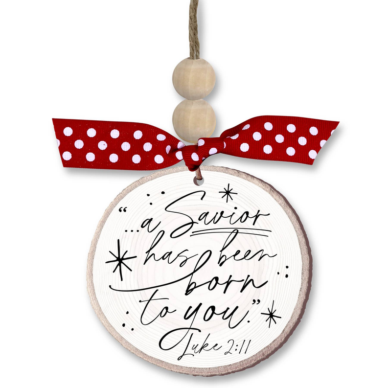 Rustic round Christmas ornament: 'a Savior has been born' text, red polka bow