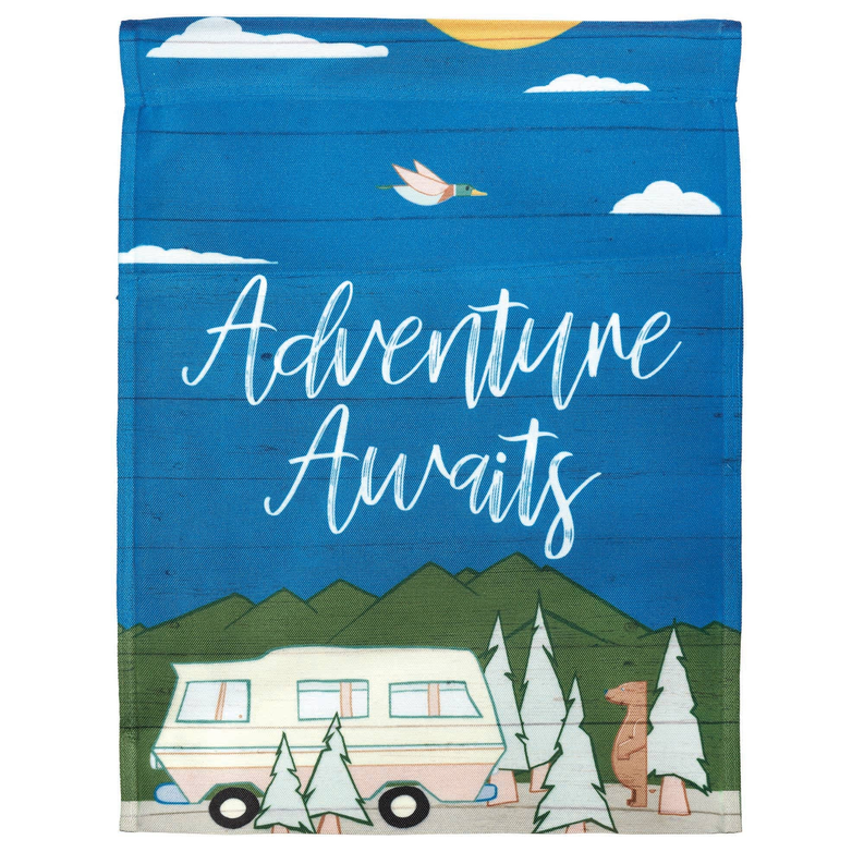 Blue printed fabric square with Adventure Awaits text, camper and mountains