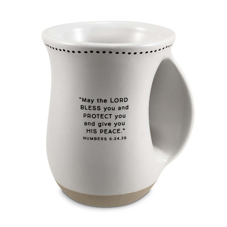 White handwarmer mug with perforated rim and scripture quote on front
