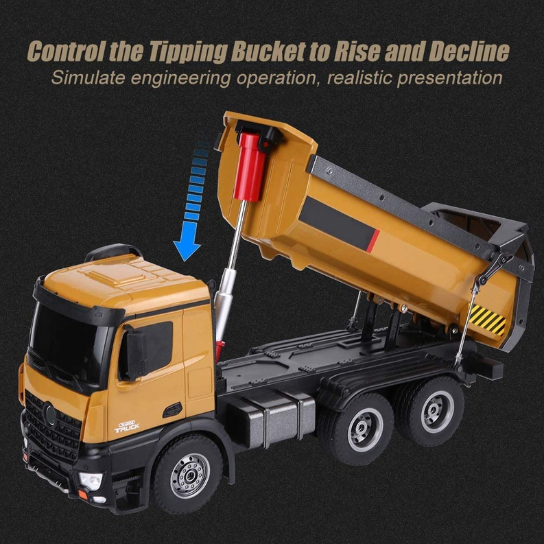 RC dump truck with control rod tipping bucket raised, studio close-up