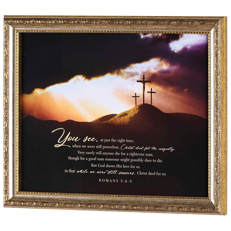 Framed Christian wall art with ornate gold border, sunset hills, and cross with scripture