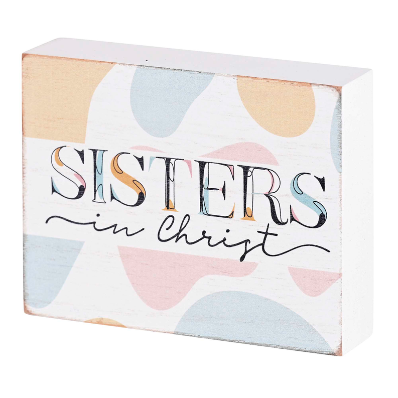 Tabletop decorative plaque: “Sisters in Christ” with pastel abstract pattern.