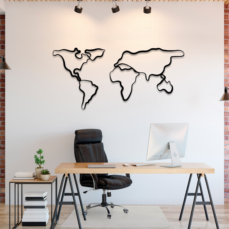 World map metal wall art, black outline mounted above a desk.