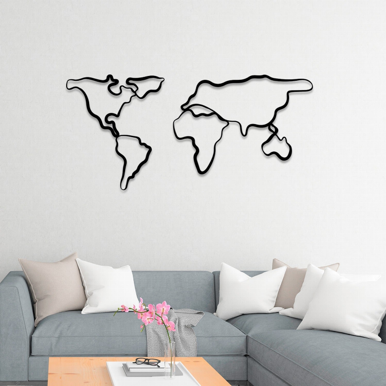 World map metal wall art with black outline, wall-mounted above sofa.