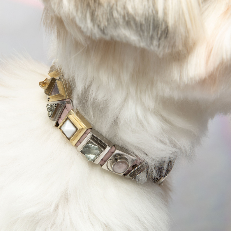 Charm collar with rose quartz moon-shaped links in gold, silver, and pink