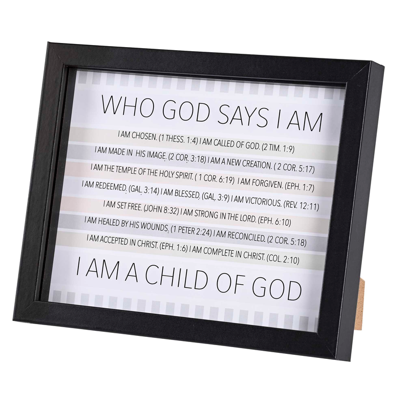 Framed wall art in black frame reading "WHO GOD SAYS I AM" and "I AM A CHILD OF GOD"