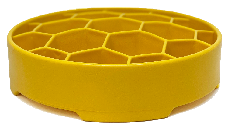 Yellow honeycomb slow feeder bowl with low profile and hex grid interior