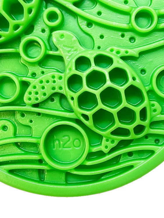 Green silicone ocean-themed bath mat featuring a textured turtle design for enhanced grip and safety.