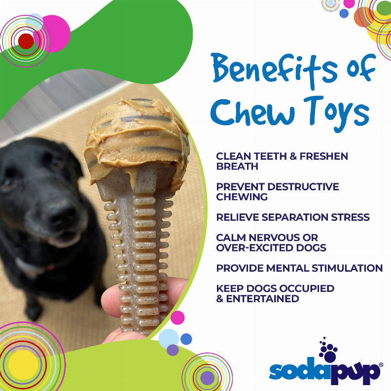 Brown dental chew tower bone toy held near a black dog