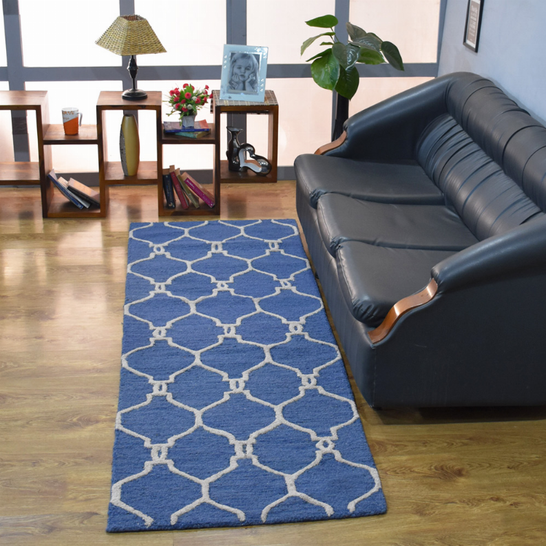 Blue geometric wool runner rug with white linked motif trellis design.
