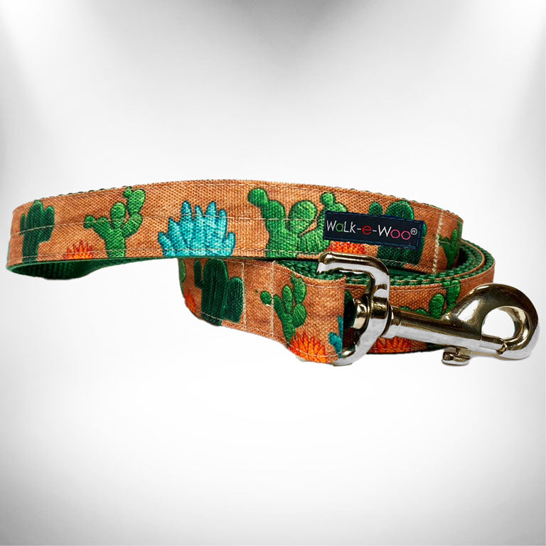Cactus-pattern dog leash with Walk-e-Woo label and metal clip, orange fabric