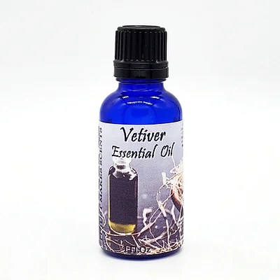 Vetiver essential oil bottle with blue glass and black ribbed cap