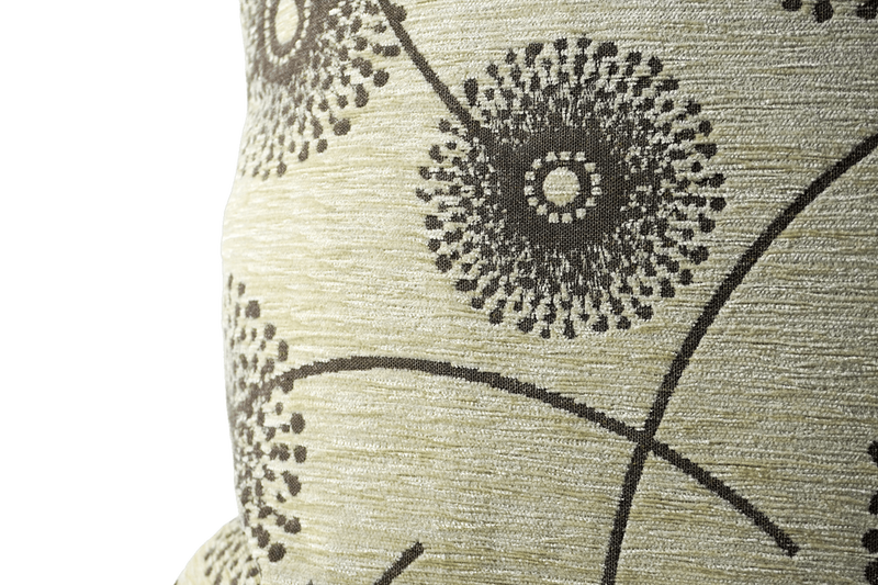 Light green textured throw pillow with black dotted floral circle pattern