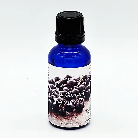 Blue fragrance oil bottle with black cap; label shows black currant fruit artwork.