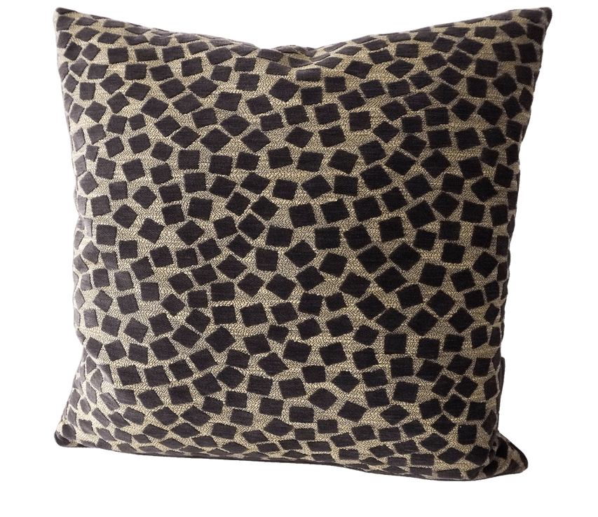 Geometric throw pillow in beige and dark tones with repeating square pattern