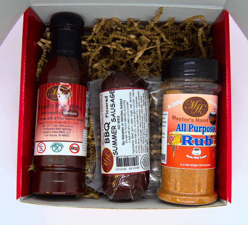Red gift set box with bottles, seasoning packet, and jar of spice rubs