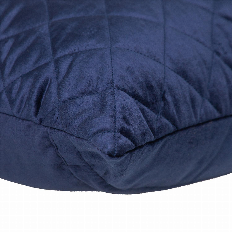 Navy quilted throw pillow corner close-up with diamond stitching texture