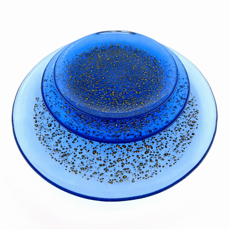 12-piece indigo blue glass dinner plate with bronze-gold speckled design