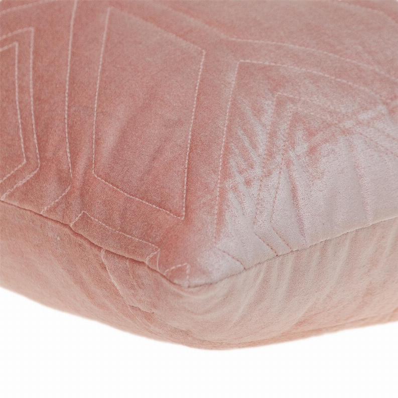 Pink quilted throw pillow close-up of chevron quilting and textured fabric