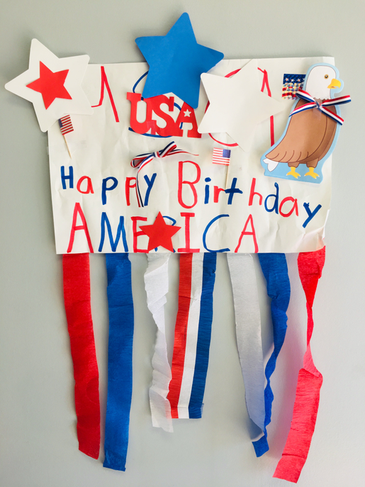 Tri-color star cut-outs on patriotic banner, red, white and blue star shapes