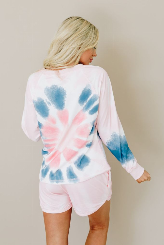 Pink and blue tie-dye lounge set, back view of pullover and drawstring shorts