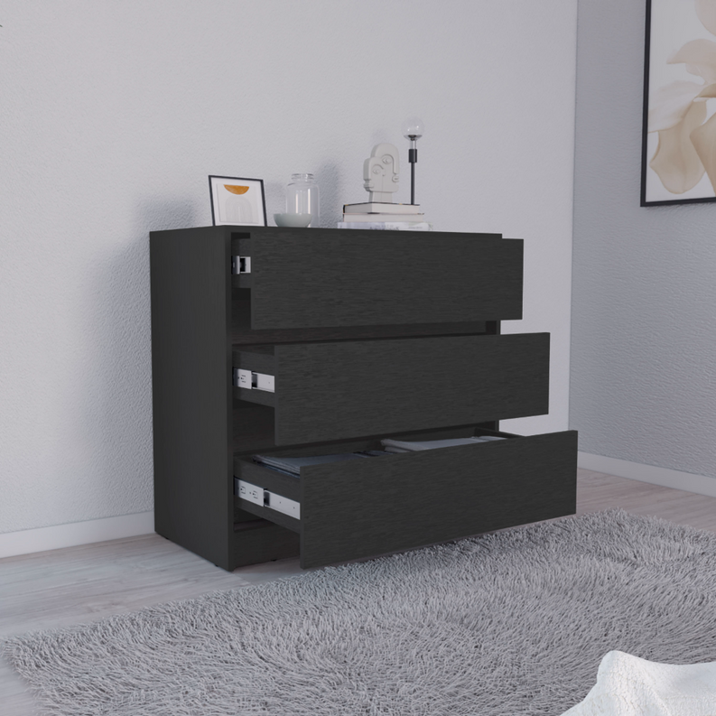 Black three-drawer dresser with three open drawers and a dark top surface.