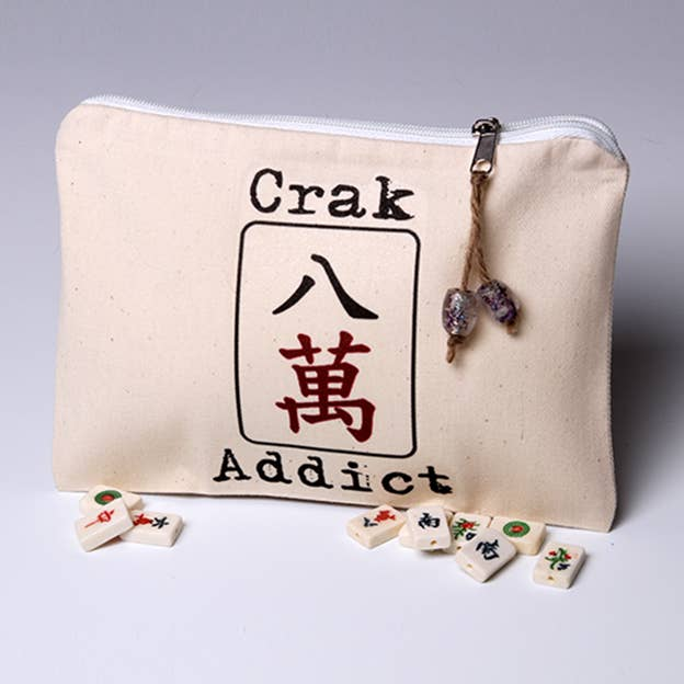Crak Addict mah jongg pouch, cream canvas zip pouch with Crak Addict logo and tile charms