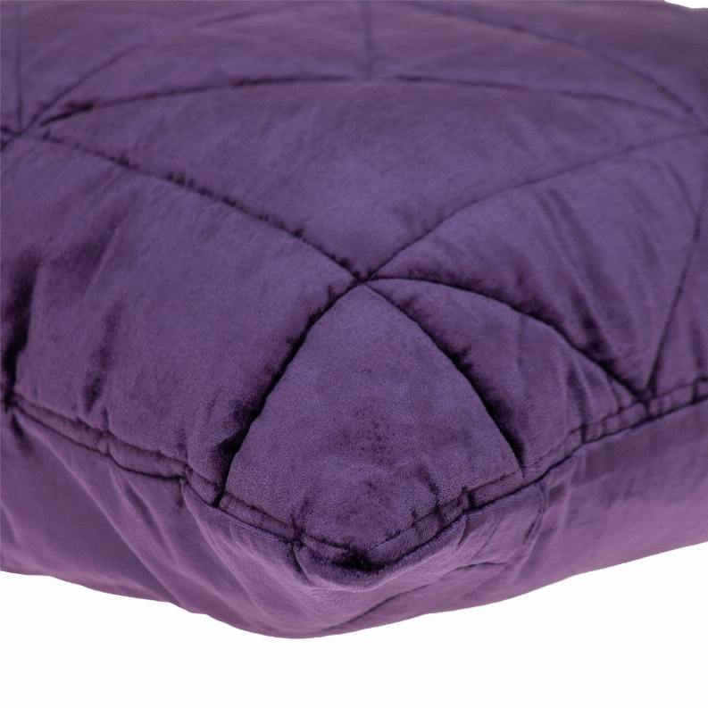 Purple velvet quilted throw pillow corner with rounded, puffy stitched edging