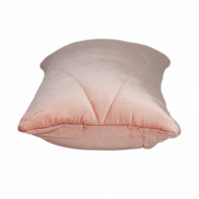 Light pink quilted throw pillow with diagonal stitch channels and piped seams