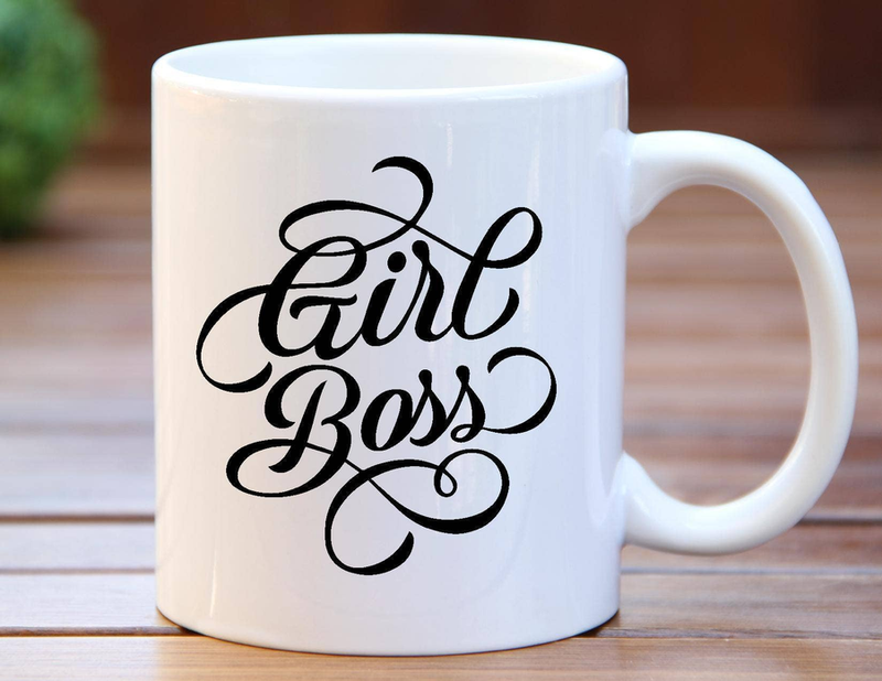 White ceramic coffee mug with black “Faith Boss” logo, side view and handle