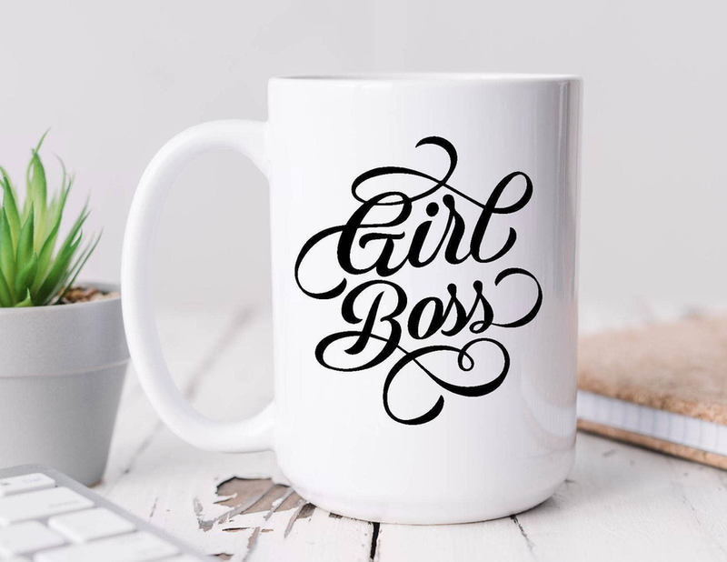 White ceramic coffee mug with black “Faith Boss” script, curved handle