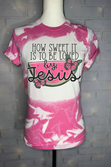 Pink and white bleached graphic T-shirt with butterfly and cursive front text
