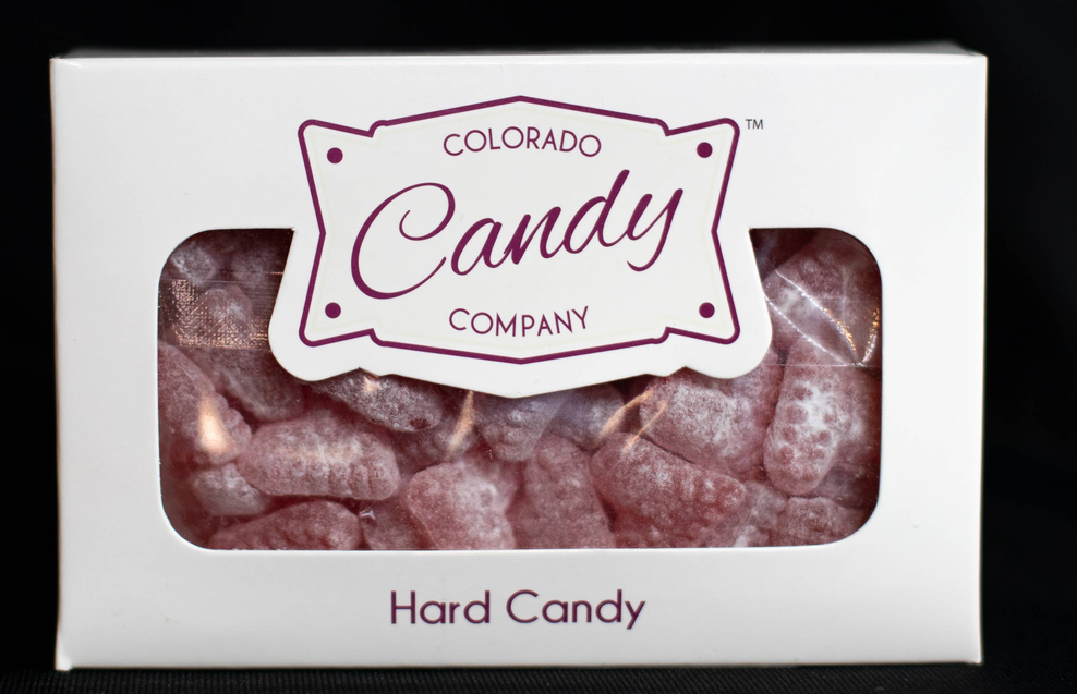Cinnamon hard candy box with clear window showing dark red wrapped candies