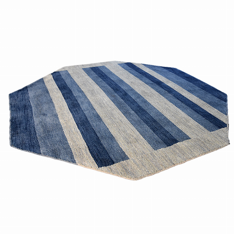 Octagon area rug laid flat with blue and light gray wide vertical stripes