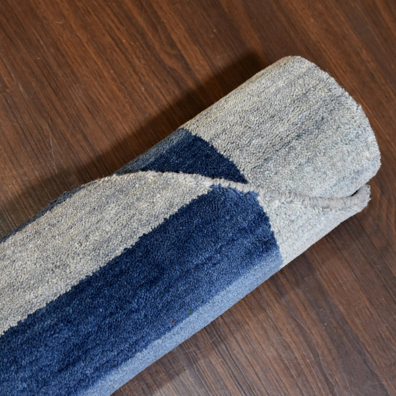 Octagon area rug, light gray field with navy stripe runner and soft texture