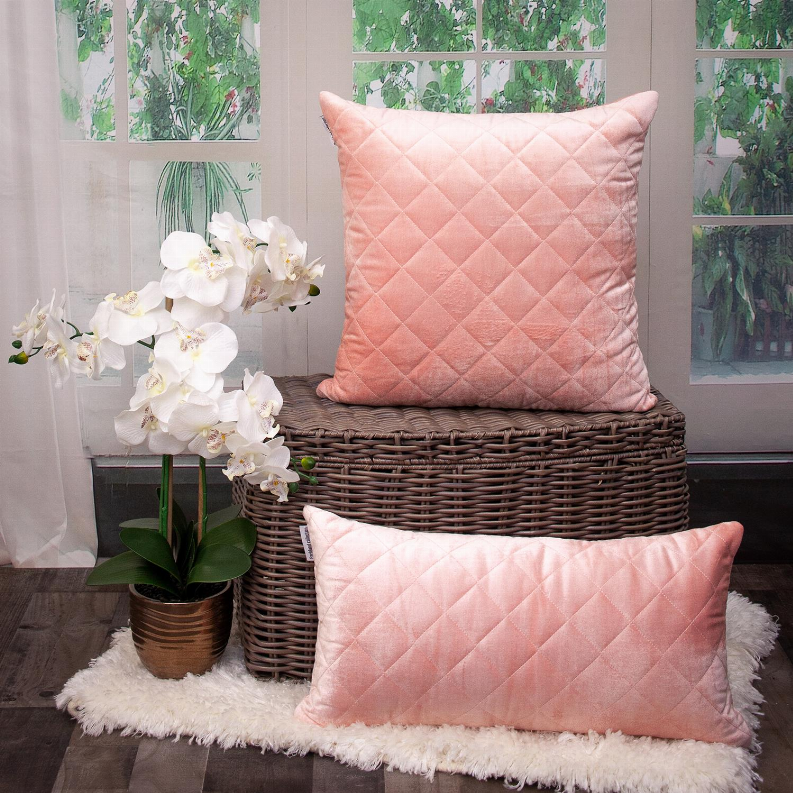Blush pink quilted throw pillow with diamond stitch pattern, square shape