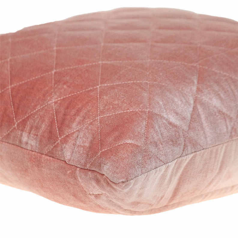 Blush pink quilted pillow close-up, stitched diamond grid texture