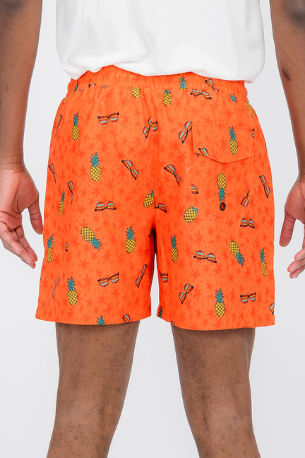 Orange pineapple and fruit print swim shorts with elastic waistband and drawstring