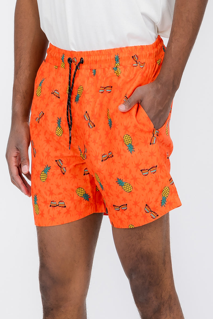 Orange pineapple-print swim shorts, elastic waistband and visible drawstring