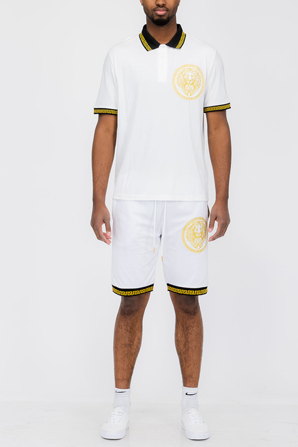 White polo shirt and matching shorts set with lion head emblem and yellow trim