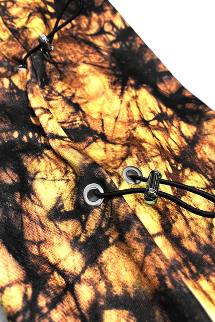 Orange and black tie-dye hoodie drawcord with metal grommets and side toggles