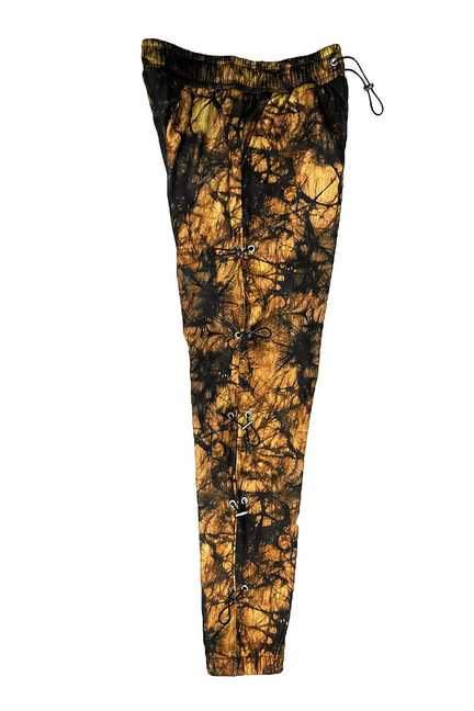 Orange and black tie-dye sweatpants with elastic waist, drawstring, and side toggles