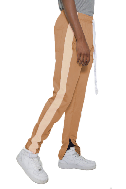 Sand cream slim track pants with side stripe, tapered legs and cuffed hem
