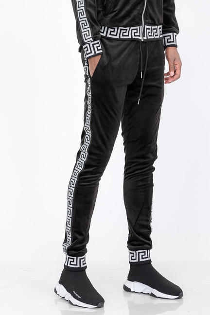 Black velour track pants with silver Greek key stripe and logo cuff detail